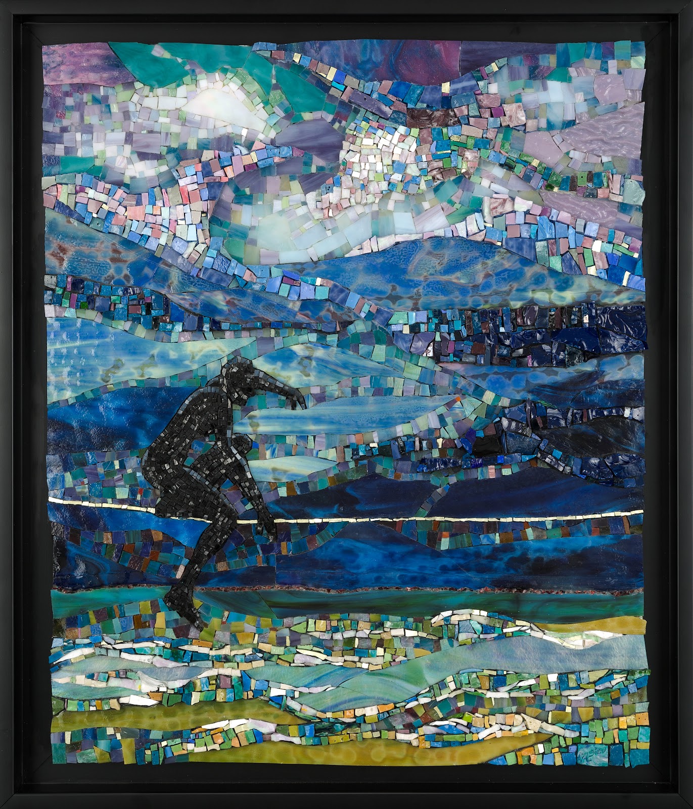 Framed mosaic artwork of a coastal scene with layered bands of blue and teal water and a sky of purple, turquoise, and white tiles. In the lower left, a dark silhouette of a person walks along the shoreline, surrounded by swirling, wave-like patterns made from small, multicolored glass pieces.