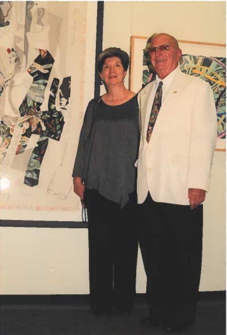 Al Berkowitz and Electra Stamelos in front of artworks