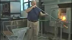 a man blowing the glass
